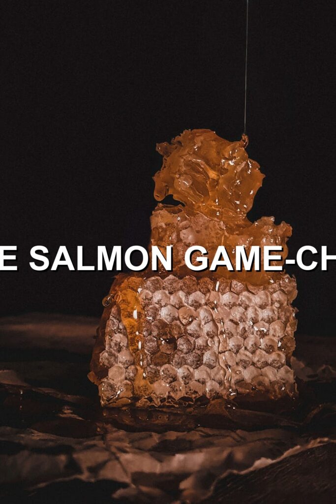 Caramel glazed salmon cake, golden brown crust encasing melted caramel, served with a side of creamy dipping sauce.