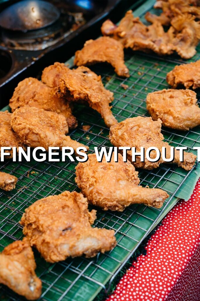 Crispy golden fried chicken fingers, perfectly cooked to a tender interior and crisp exterior, ready for a mouthwatering meal.