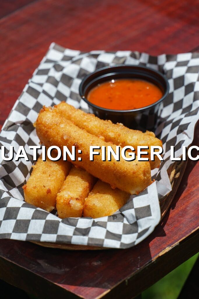 Savor this mouth-watering fingerling fry with golden, crispy skin and tantalizingly fluffy interiors, perfectly dipped in vibrant red sauce.